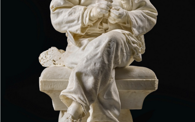 Marble sculpture of a poor boy taking his lunch
